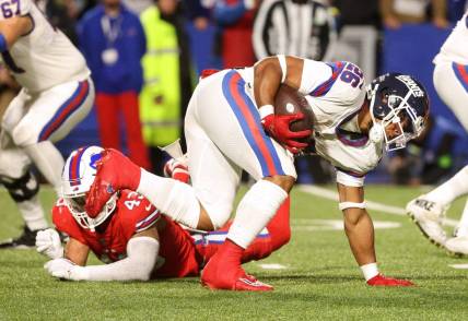 New York Giants running back Saquon Barkley (26) regains his balance on this run against the Bills.
