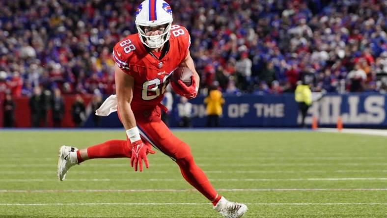 Oct 15, 2023; Orchard Park, New York, USA; Buffalo Bills tight end Dawson Knox (88) runs with the ball after making a catch against the New York Giants during the second half at Highmark Stadium. Mandatory Credit: Gregory Fisher-USA TODAY Sports