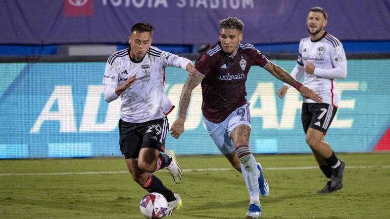 Oct 14, 2023; Frisco, TX, USA; Colorado Rapids forward Rafael Navarro (9) and FC Dallas defender Sam Junqua (29) in action in front of Advocare signage during the game between FC Dallas and the Colorado Rapids at Toyota Stadium. Mandatory Credit: Jerome Miron-USA TODAY Sports