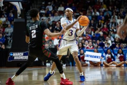 Kansas guard Dajuan Harris Jr. looks to make a pass against Howard during his team's first-round game in the 2023 NCAA men's tournament