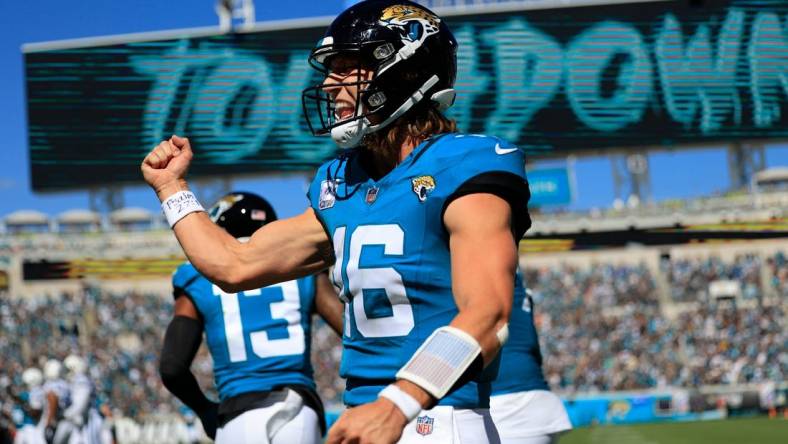 Jacksonville Jaguars quarterback Trevor Lawrence (16) celebrates his pass for a touchdown score to wide receiver Christian Kirk (13) during the second quarter of an NFL football matchup Sunday, Oct. 15, 2023 at EverBank Stadium in Jacksonville, Fla. The Jacksonville Jaguars defeated the Indianapolis Colts 37-20. [Corey Perrine/Florida Times-Union]