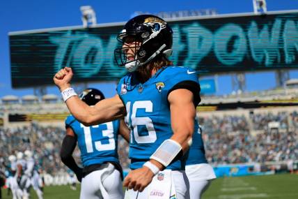 Jacksonville Jaguars quarterback Trevor Lawrence (16) celebrates his pass for a touchdown score to wide receiver Christian Kirk (13) during the second quarter of an NFL football matchup Sunday, Oct. 15, 2023 at EverBank Stadium in Jacksonville, Fla. The Jacksonville Jaguars defeated the Indianapolis Colts 37-20. [Corey Perrine/Florida Times-Union]
