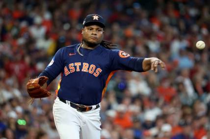 Oct 16, 2023; Houston, Texas, USA; Houston Astros starting pitcher Framber Valdez (59) throws to first base  in the second inning against the Texas Rangers during game two of the ALCS for the 2023 MLB playoffs at Minute Maid Park. Mandatory Credit: Thomas Shea-USA TODAY Sports