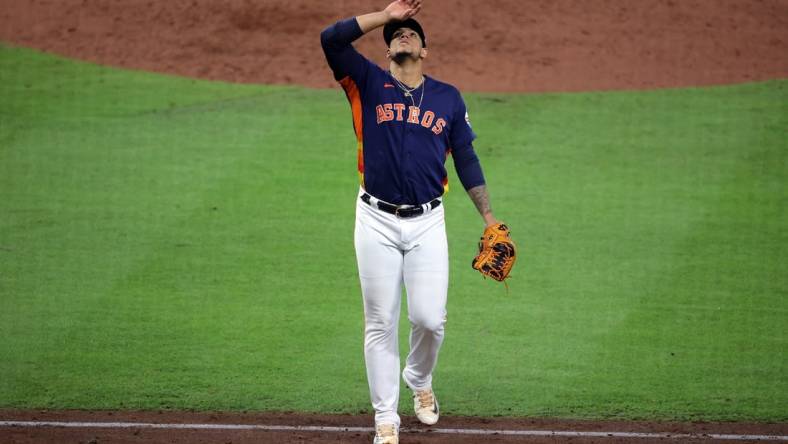 Oct 16, 2023; Houston, Texas, USA; Houston Astros relief pitcher Bryan Abreu (52) reacts in the eighth inning against the Texas Rangers during game two of the ALCS for the 2023 MLB playoffs at Minute Maid Park. Mandatory Credit: Erik Williams-USA TODAY Sports