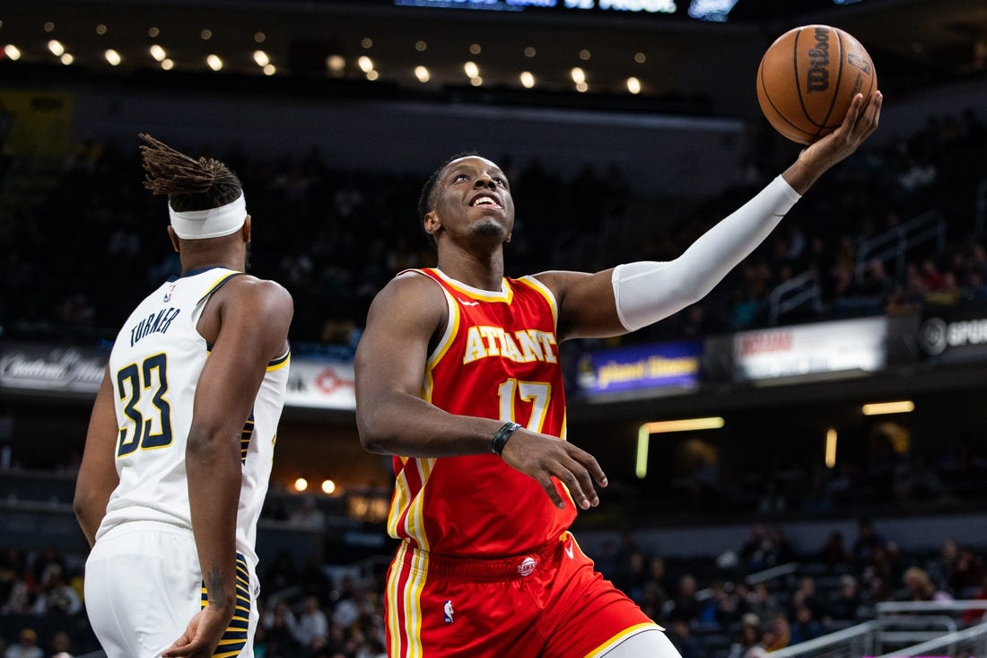 Oct 16, 2023; Indianapolis, Indiana, USA;  Atlanta Hawks forward Onyeka Okongwu (17) shoots the ball while Indiana Pacers center Myles Turner (33) defends in the second quarter at Gainbridge Fieldhouse. Mandatory Credit: Trevor Ruszkowski-USA TODAY Sports