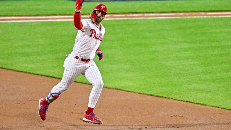 Oct 16, 2023; Philadelphia, Pennsylvania, USA; Philadelphia Phillies first baseman Bryce Harper (3) hits a solo home run during the first inning against the Arizona Diamondbacks in game one of the NLCS for the 2023 MLB playoffs at Citizens Bank Park. Mandatory Credit: Kyle Ross-USA TODAY Sports