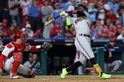 Oct 16, 2023; Philadelphia, Pennsylvania, USA; Arizona Diamondbacks shortstop Geraldo Perdomo (2) hits a two run home run during the sixth inning against the Philadelphia Phillies in game one of the NLCS for the 2023 MLB playoffs at Citizens Bank Park. Mandatory Credit: Bill Streicher-USA TODAY Sports
