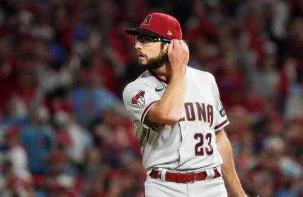 Arizona Diamondbacks starting pitcher Zac Gallen (23) reacts after giving up a solo home run to the Philadelphia Phillies in the second inning during Game 1 of the NLCS at Citizens Bank Park in Philadelphia on Oct. 16, 2023.