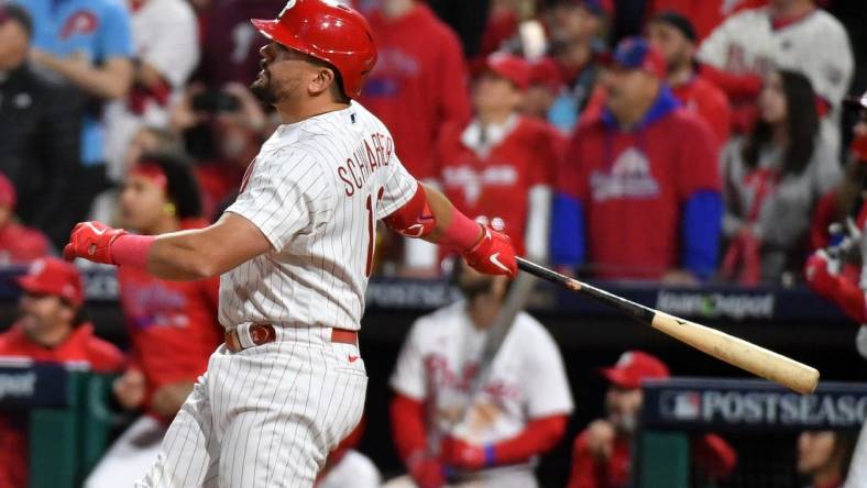 Oct 17, 2023; Philadelphia, Pennsylvania, USA; Philadelphia Phillies left fielder Kyle Schwarber (12) hits a home run against the Arizona Diamondbacks during the sixth inning for game two of the NLCS for the 2023 MLB playoffs at Citizens Bank Park. Mandatory Credit: Eric Hartline-USA TODAY Sports