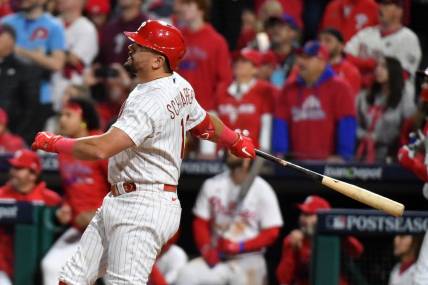 Oct 17, 2023; Philadelphia, Pennsylvania, USA; Philadelphia Phillies left fielder Kyle Schwarber (12) hits a home run against the Arizona Diamondbacks during the sixth inning for game two of the NLCS for the 2023 MLB playoffs at Citizens Bank Park. Mandatory Credit: Eric Hartline-USA TODAY Sports