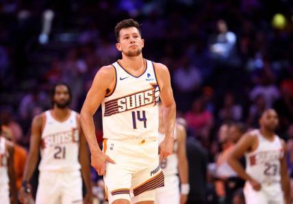 Oct 10, 2023; Phoenix, Arizona, USA; Phoenix Suns forward Drew Eubanks (14) against the Denver Nuggets during a preseason game at Footprint Center. Mandatory Credit: Mark J. Rebilas-USA TODAY Sports