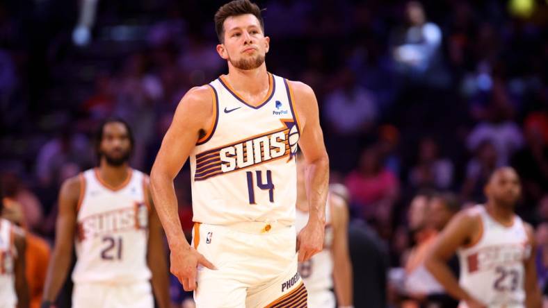 Oct 10, 2023; Phoenix, Arizona, USA; Phoenix Suns forward Drew Eubanks (14) against the Denver Nuggets during a preseason game at Footprint Center. Mandatory Credit: Mark J. Rebilas-USA TODAY Sports