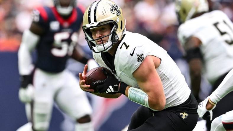 Oct 15, 2023; Houston, Texas, USA; New Orleans Saints quarterback Taysom Hill (7) catches a pass during the second quarter against the Houston Texans at NRG Stadium. Mandatory Credit: Maria Lysaker-USA TODAY Sports