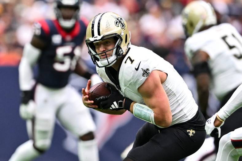 Oct 15, 2023; Houston, Texas, USA; New Orleans Saints quarterback Taysom Hill (7) catches a pass during the second quarter against the Houston Texans at NRG Stadium. Mandatory Credit: Maria Lysaker-USA TODAY Sports
