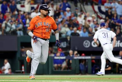 Oct 18, 2023; Arlington, Texas, USA; Houston Astros catcher Martin Maldonado (15) hits a RBI single during the second inning of game three of the ALCS against the Texas Rangers in the 2023 MLB playoffs at Globe Life Field. Mandatory Credit: Kevin Jairaj-USA TODAY Sports