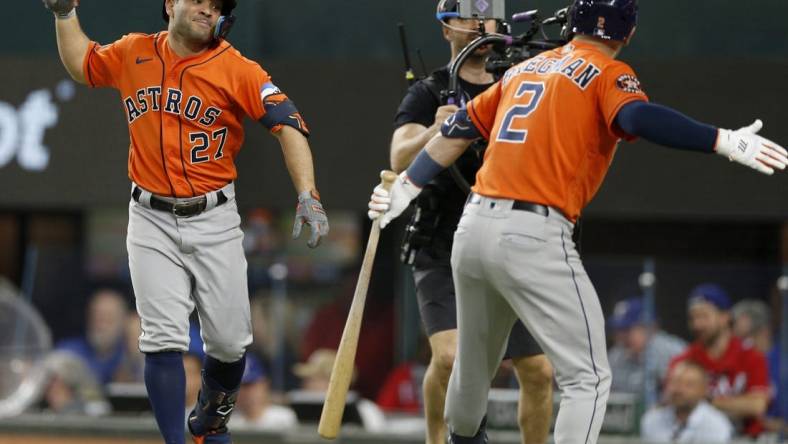 Oct 18, 2023; Arlington, Texas, USA; Houston Astros second baseman Jose Altuve (27) celebrates with third baseman Alex Bregman (2) after a solo home run during the third inning of game three of the ALCS against the Texas Rangers in the 2023 MLB playoffs at Globe Life Field. Mandatory Credit: Andrew Dieb-USA TODAY Sports