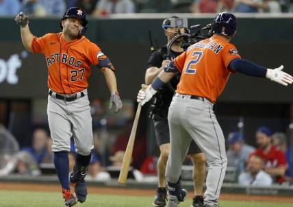 Oct 18, 2023; Arlington, Texas, USA; Houston Astros second baseman Jose Altuve (27) celebrates with third baseman Alex Bregman (2) after a solo home run during the third inning of game three of the ALCS against the Texas Rangers in the 2023 MLB playoffs at Globe Life Field. Mandatory Credit: Andrew Dieb-USA TODAY Sports