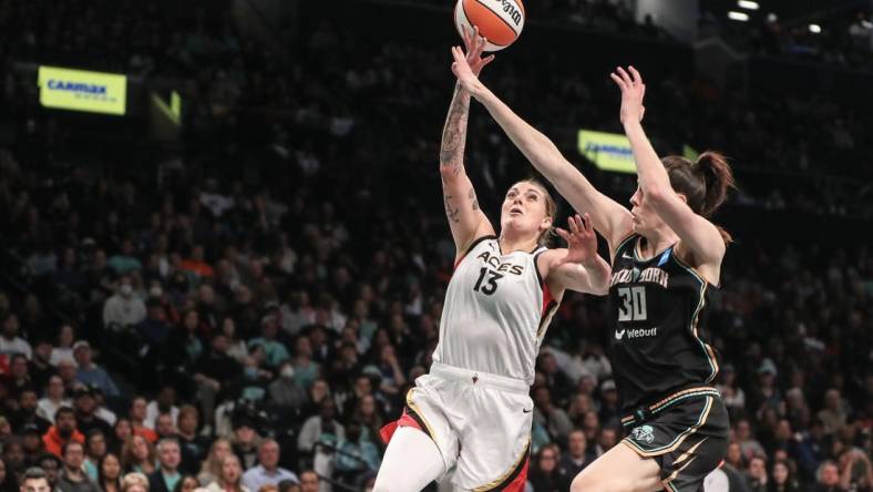 Oct 18, 2023; Brooklyn, New York, USA; Las Vegas Aces forward Cayla George (13) drives past New York Liberty forward Breanna Stewart (30) in the second quarter during game four of the 2023 WNBA Finals at Barclays Center. Mandatory Credit: Wendell Cruz-USA TODAY Sports