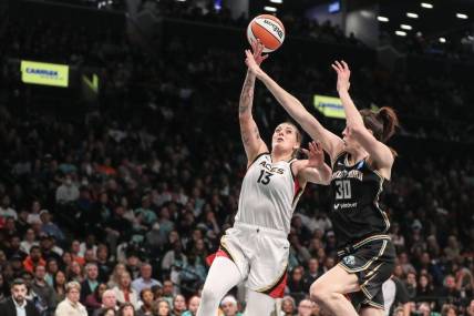 Oct 18, 2023; Brooklyn, New York, USA; Las Vegas Aces forward Cayla George (13) drives past New York Liberty forward Breanna Stewart (30) in the second quarter during game four of the 2023 WNBA Finals at Barclays Center. Mandatory Credit: Wendell Cruz-USA TODAY Sports