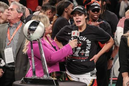 Oct 18, 2023; Brooklyn, New York, USA; Las Vegas Aces guard Kelsey Plum (10) is interviewed by ESPN reporter Holly Rowe after defeating the New York Liberty to win the 2023 WNBA Finals at Barclays Center. Mandatory Credit: Wendell Cruz-USA TODAY Sports