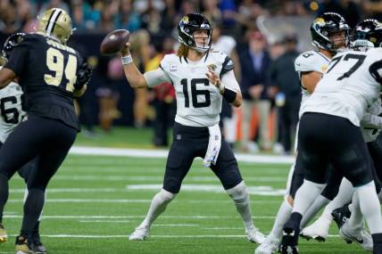 Oct 19, 2023; New Orleans, Louisiana, USA; Jacksonville Jaguars quarterback Trevor Lawrence (16) throws against the New Orleans Saints during the first quarter at the Caesars Superdome. Mandatory Credit: Matthew Hinton-USA TODAY Sports