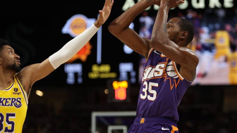 Oct 19, 2023; Palm Desert, California, USA; Phoenix Suns forward Kevin Durant (35) shoots the ball over Los Angeles Lakers forward Christian Wood (35) during the first quarter at Acrisure Arena. Mandatory Credit: Kiyoshi Mio-USA TODAY Sports