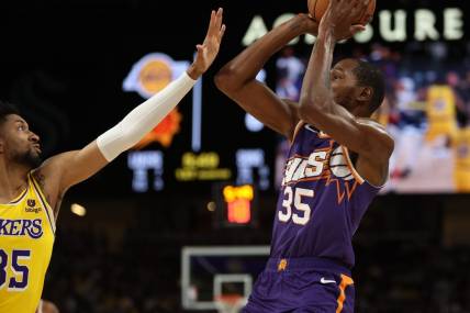 Oct 19, 2023; Palm Desert, California, USA; Phoenix Suns forward Kevin Durant (35) shoots the ball over Los Angeles Lakers forward Christian Wood (35) during the first quarter at Acrisure Arena. Mandatory Credit: Kiyoshi Mio-USA TODAY Sports