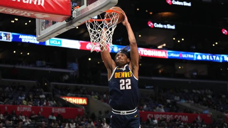 Oct 19, 2023; Los Angeles, California, USA; Denver Nuggets forward Zeke Nnaji (22) dunks the ball against the LA Clippers in the second half at Crypto.com Arena. Mandatory Credit: Kirby Lee-USA TODAY Sports