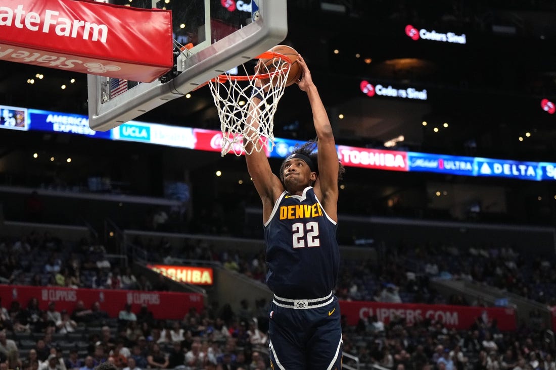 Oct 19, 2023; Los Angeles, California, USA; Denver Nuggets forward Zeke Nnaji (22) dunks the ball against the LA Clippers in the second half at Crypto.com Arena. Mandatory Credit: Kirby Lee-USA TODAY Sports