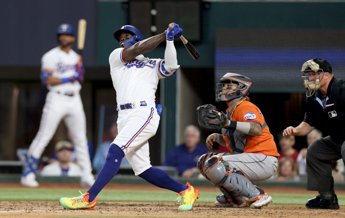 Oct 20, 2023; Arlington, Texas, USA; Texas Rangers right fielder Adolis Garcia (53) hits a three-run home run during the sixth inning of game five in the ALCS against the Houston Astros for the 2023 MLB playoffs at Globe Life Field. Mandatory Credit: Andrew Dieb-USA TODAY Sports