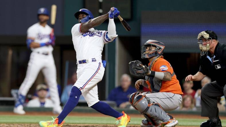 Oct 20, 2023; Arlington, Texas, USA; Texas Rangers right fielder Adolis Garcia (53) hits a three-run home run during the sixth inning of game five in the ALCS against the Houston Astros for the 2023 MLB playoffs at Globe Life Field. Mandatory Credit: Andrew Dieb-USA TODAY Sports