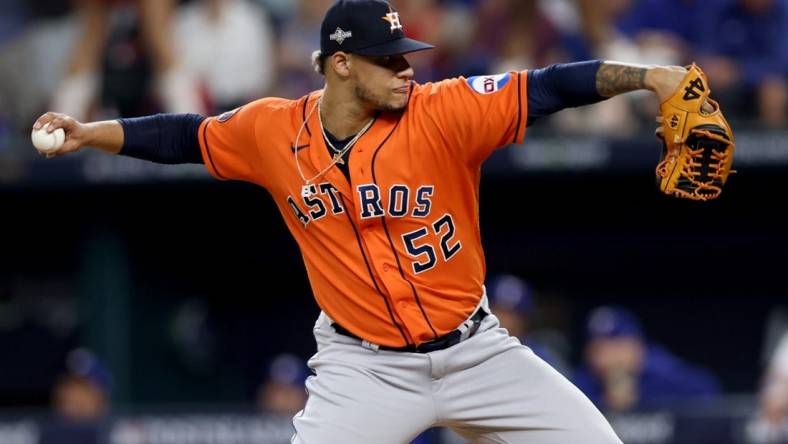 Oct 20, 2023; Arlington, Texas, USA; Houston Astros pitcher Bryan Abreu (52) throws during the eighth inning of game five in the ALCS against the Texas Rangers for the 2023 MLB playoffs at Globe Life Field. Mandatory Credit: Andrew Dieb-USA TODAY Sports