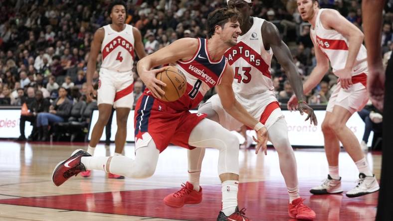 Oct 20, 2023; Toronto, Ontario, CAN; Washington Wizards forward Deni Avdija (8) drives to the net against Toronto Raptors forward Pascal Siakam (43) during the second half at Scotiabank Arena. Mandatory Credit: John E. Sokolowski-USA TODAY Sports