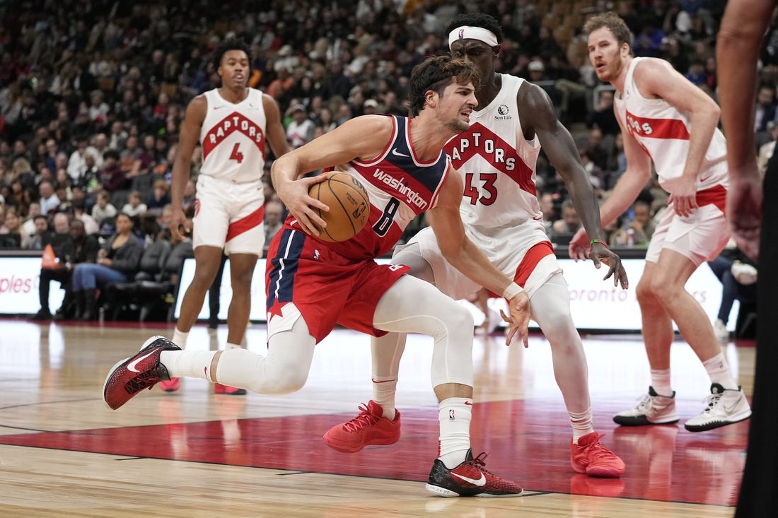 Oct 20, 2023; Toronto, Ontario, CAN; Washington Wizards forward Deni Avdija (8) drives to the net against Toronto Raptors forward Pascal Siakam (43) during the second half at Scotiabank Arena. Mandatory Credit: John E. Sokolowski-USA TODAY Sports