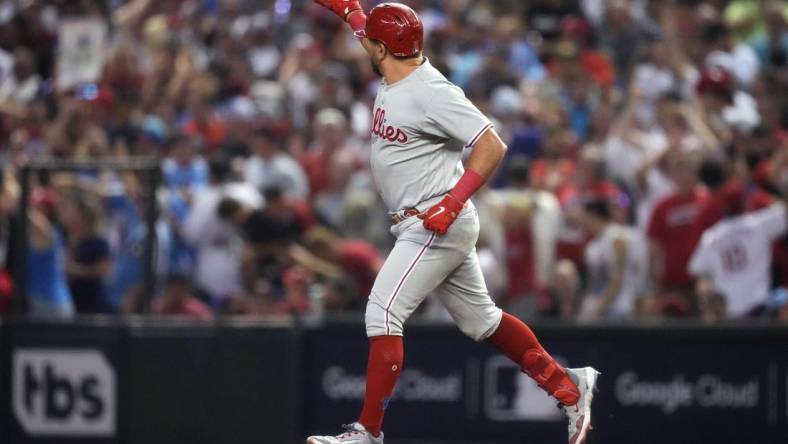 Philadelphia Phillies designated hitter Kyle Schwarber (12) celebrates after hitting a home run during the fourth inning against the Arizona Diamondbacks in game four of the NLCS of the 2023 MLB playoffs at Chase Field in Phoenix on Oct. 20, 2023.