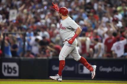 Philadelphia Phillies designated hitter Kyle Schwarber (12) celebrates after hitting a home run during the fourth inning against the Arizona Diamondbacks in game four of the NLCS of the 2023 MLB playoffs at Chase Field in Phoenix on Oct. 20, 2023.