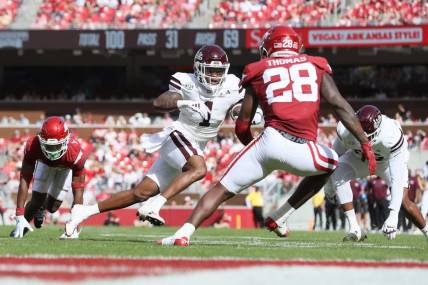 Oct 21, 2023; Fayetteville, Arkansas, USA; Mississippi State Bulldogs wide receiver Zavion Thomas (1) runs after a catch against the Arkansas Razorbacks in the second quarter at Donald W. Reynolds Razorback Stadium. Mandatory Credit: Nelson Chenault-USA TODAY Sports