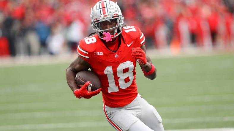 Oct 21, 2023; Columbus, Ohio, USA;  Ohio State Buckeyes wide receiver Marvin Harrison Jr. (18) scores a touchdown against the Penn State Nittany Lions during the fourth quarter at Ohio Stadium. Mandatory Credit: Joseph Maiorana-USA TODAY Sports