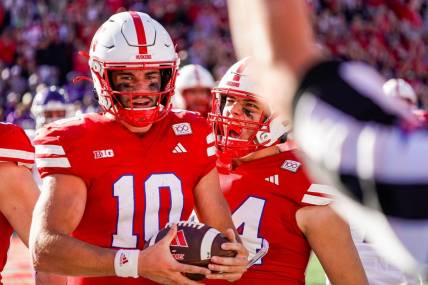 Oct 21, 2023; Lincoln, Nebraska, USA; Nebraska Cornhuskers quarterback Heinrich Haarberg (10) and tight end Luke Lindenmeyer (44) celebrate after a touchdown by Haarberg against the Northwestern Wildcats during the second quarter at Memorial Stadium. Mandatory Credit: Dylan Widger-USA TODAY Sports