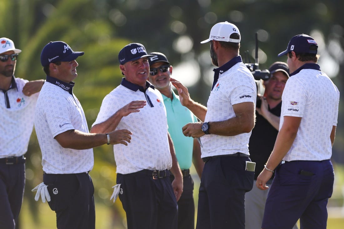 Oct 21, 2023; Doral, Florida, USA; Dustin Johnson celebrates with teammates Patrick Reed, Pat Perez and Peter Uihlein during the second round of the LIV Golf Miami golf tournament at Trump National Doral. Mandatory Credit: Sam Navarro-USA TODAY Sports