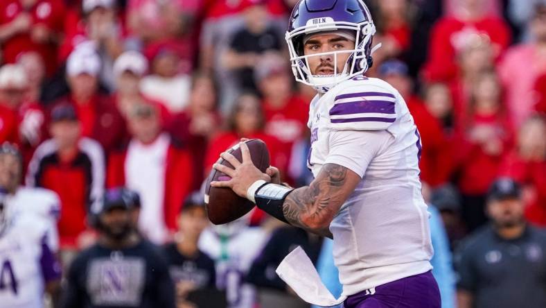 Oct 21, 2023; Lincoln, Nebraska, USA; Northwestern Wildcats quarterback Brendan Sullivan (6) looks for a pass against the Nebraska Cornhuskers during the fourth quarter at Memorial Stadium. Mandatory Credit: Dylan Widger-USA TODAY Sports