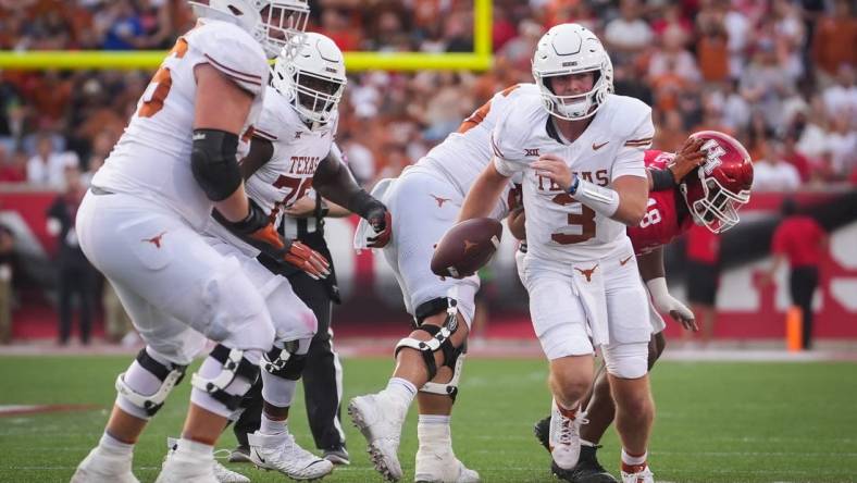 Texas quarterback Quinn Ewers (3) carries the ball in the third quarter of the Texas Longhorn's game against the Cougars at TDECU Stadium in Houston, Saturday, Oct. 21, 2023.