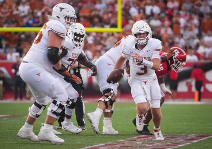 Texas quarterback Quinn Ewers (3) carries the ball in the third quarter of the Texas Longhorn's game against the Cougars at TDECU Stadium in Houston, Saturday, Oct. 21, 2023.