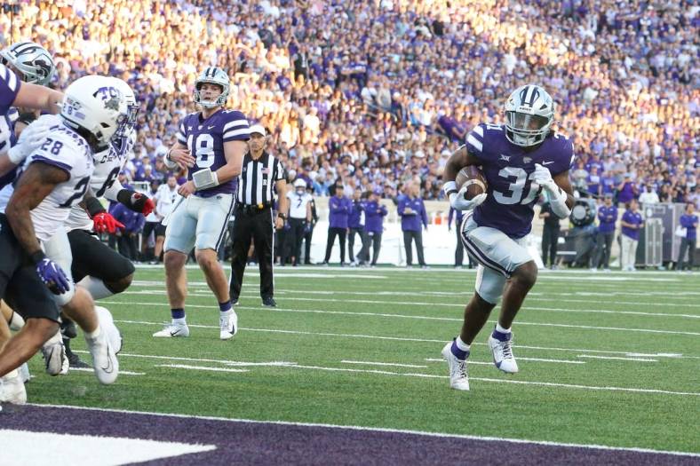 Oct 21, 2023; Manhattan, Kansas, USA; Kansas State Wildcats running back DJ Giddens (31) scores an easy touchdown during the first quarter against the TCU Horned Frogs at Bill Snyder Family Football Stadium. Mandatory Credit: Scott Sewell-USA TODAY Sports