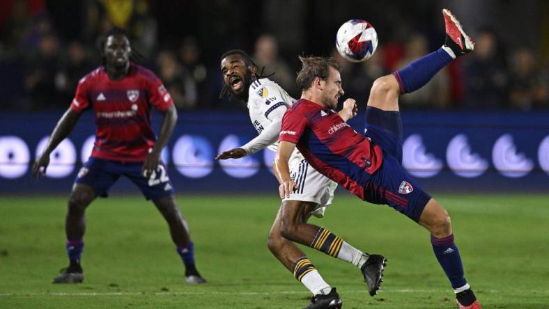 Oct 21, 2023; Carson, California, USA; FC Dallas midfielder Paxton Pomykal (19) plays the ball against Los Angeles Galaxy forward Raheem Edwards (44) during the second half at Dignity Health Sports Park. Mandatory Credit: Kelvin Kuo-USA TODAY Sports