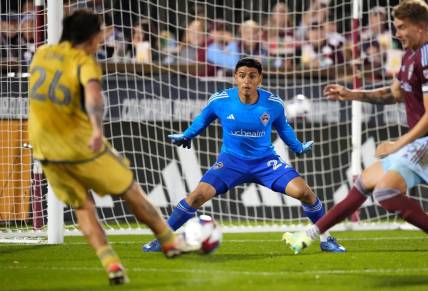 Oct 21, 2023; Commerce City, Colorado, USA; Real Salt Lake midfielder Diego Luna (26) shoots and scores on Colorado Rapids goalkeeper Abraham Rodriguez (26) and in the second half at Dick's Sporting Goods Park. Mandatory Credit: Ron Chenoy-USA TODAY Sports
