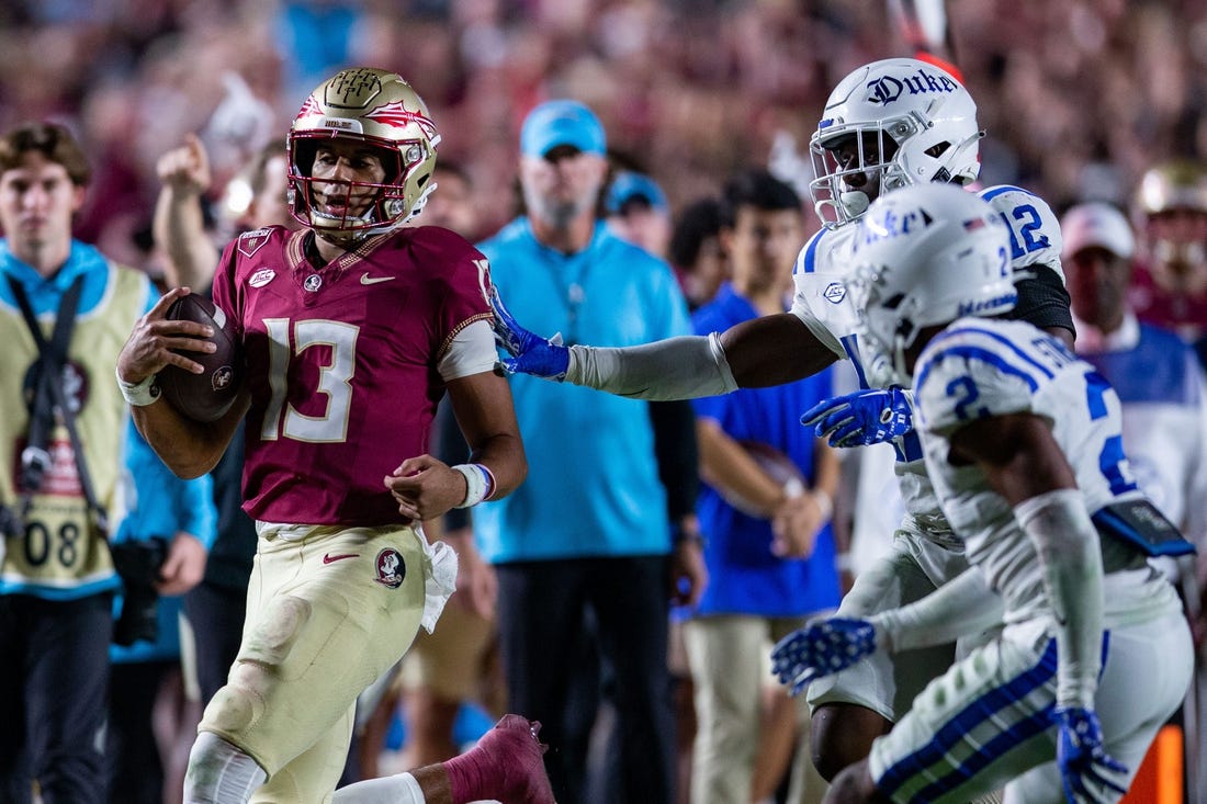 Florida State Seminoles quarterback Jordan Travis (13) runs out of bounds. The Florida State Seminoles defeated the Duke Blue Devils 38-20 on Saturday, Oct. 21, 2023.