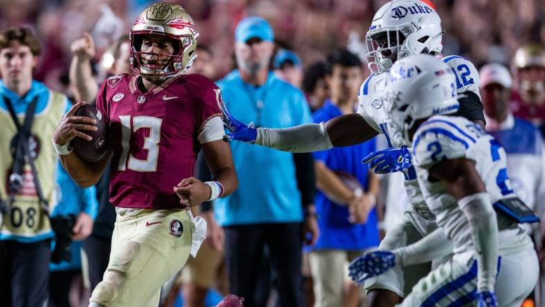 Florida State Seminoles quarterback Jordan Travis (13) runs out of bounds. The Florida State Seminoles defeated the Duke Blue Devils 38-20 on Saturday, Oct. 21, 2023.