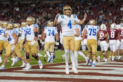 Oct 21, 2023; Stanford, California, USA; UCLA Bruins quarterback Ethan Garbers (4) reacts after a touchdown by running back Carson Steele (not shown) during the second quarter against the Stanford Cardinal at Stanford Stadium. Mandatory Credit: Darren Yamashita-USA TODAY Sports