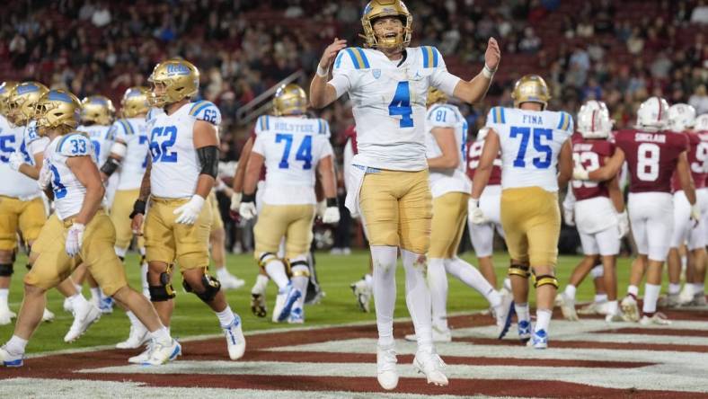 Oct 21, 2023; Stanford, California, USA; UCLA Bruins quarterback Ethan Garbers (4) reacts after a touchdown by running back Carson Steele (not shown) during the second quarter against the Stanford Cardinal at Stanford Stadium. Mandatory Credit: Darren Yamashita-USA TODAY Sports